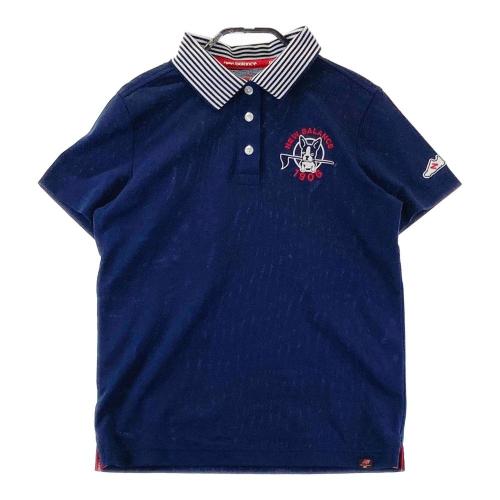 サイズ：5 NEW BALANCE GOLF ニューバランス  半袖ポロシャツ 総柄 ネイビー系 [240101287663] ゴルフウェア メンズ ストスト NEW BALANCE GOLF ニューバランス 半袖ポロシャツ ロゴ総柄