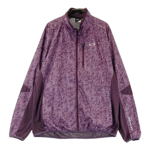 サイズ：M OAKLEY オークリー  モックネックブルゾン 総柄 パープル系 [240101478165] ゴルフウェア メンズ ストスト OAKLEY オークリー モックネックブルゾン 総柄 パープル系