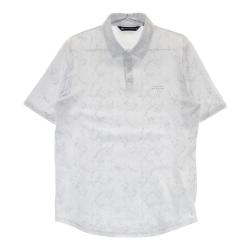サイズ：M TRAVIS MATHEW トラビスマシュー  半袖ポロシャツ 総柄 ホワイト系 [240101423288] ゴルフウェア メンズ ストスト TRAVISMATHEW TRAVIS MATHEW トラビスマシュー 半袖ポロシャツ