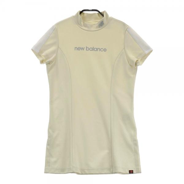 サイズ：1 NEW BALANCE GOLF ニューバランス 2023年モデル ハイネック 半袖Tシャツ チュニック丈 総柄 ベージュ系 [240101438794] ゴルフウェア レディース ストスト NEW BALANCE GOLF ニューバランス 2023年モデル ハイネック 半袖