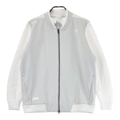 サイズ：XL OAKLEY オークリー FOA406913 2024年モデル ニット切替 裏起毛 ジップジャケット  グレー系 [240101459728] ゴルフウェア メンズ ストスト OAKLEY オークリー FOA406913 2024年モデル ニット切替 裏起毛