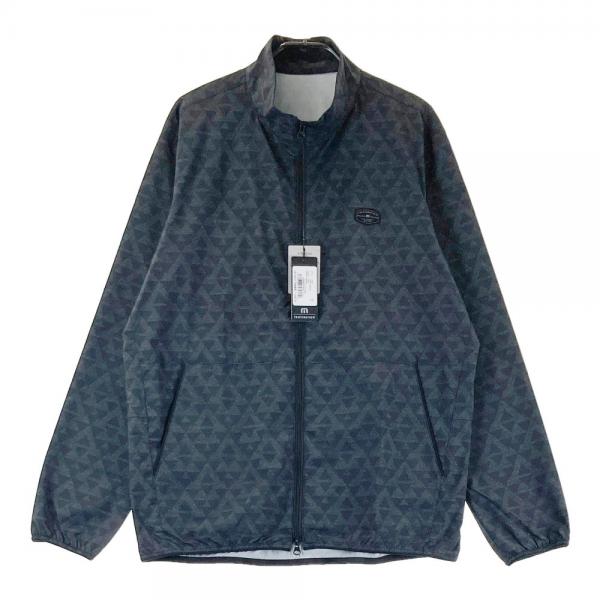 サイズ：M TRAVIS MATHEW トラビスマシュー  ウインドジャケット 総柄 ブラック系 [240101460612] ゴルフウェア メンズ ストスト TRAVIS MATHEW トラビスマシュー ウインドジャケット 総柄