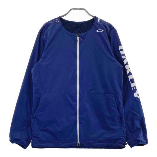 サイズ：M OAKLEY オークリー 2023年モデル リバーシブル フリース ジップジャケット  ネイビー系 [240101503079] ゴルフウェア メンズ ストスト OAKLEY オークリー 2023年モデル リバーシブル フリース ジップ